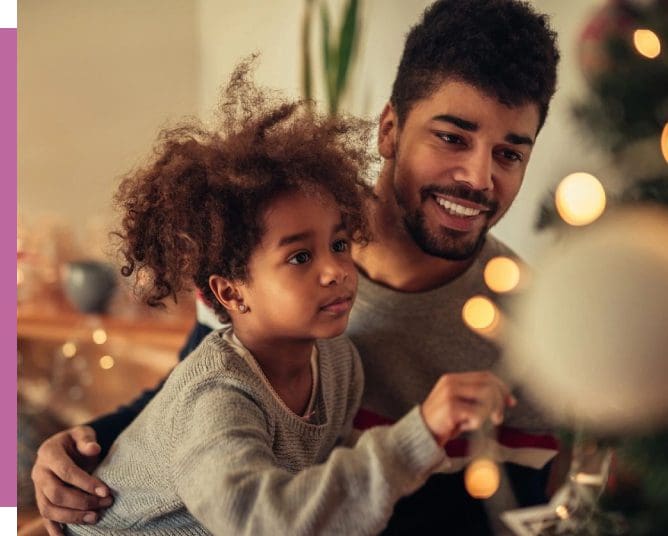A man and child are playing video games.